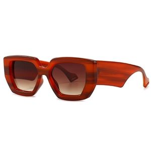 Thick Rectangle like framed sunglasses in burnt orange.